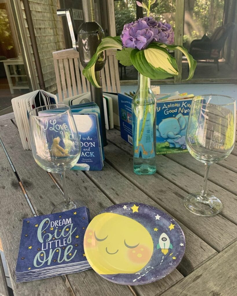 table with books for baby shower