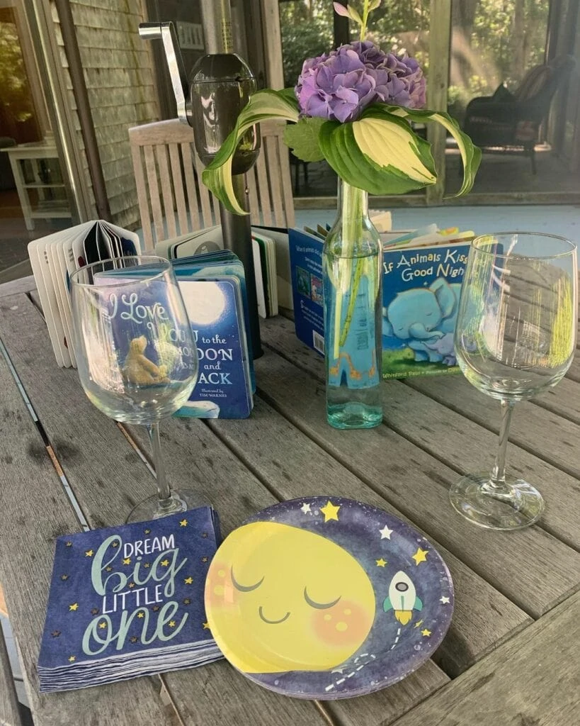 table with books for baby shower