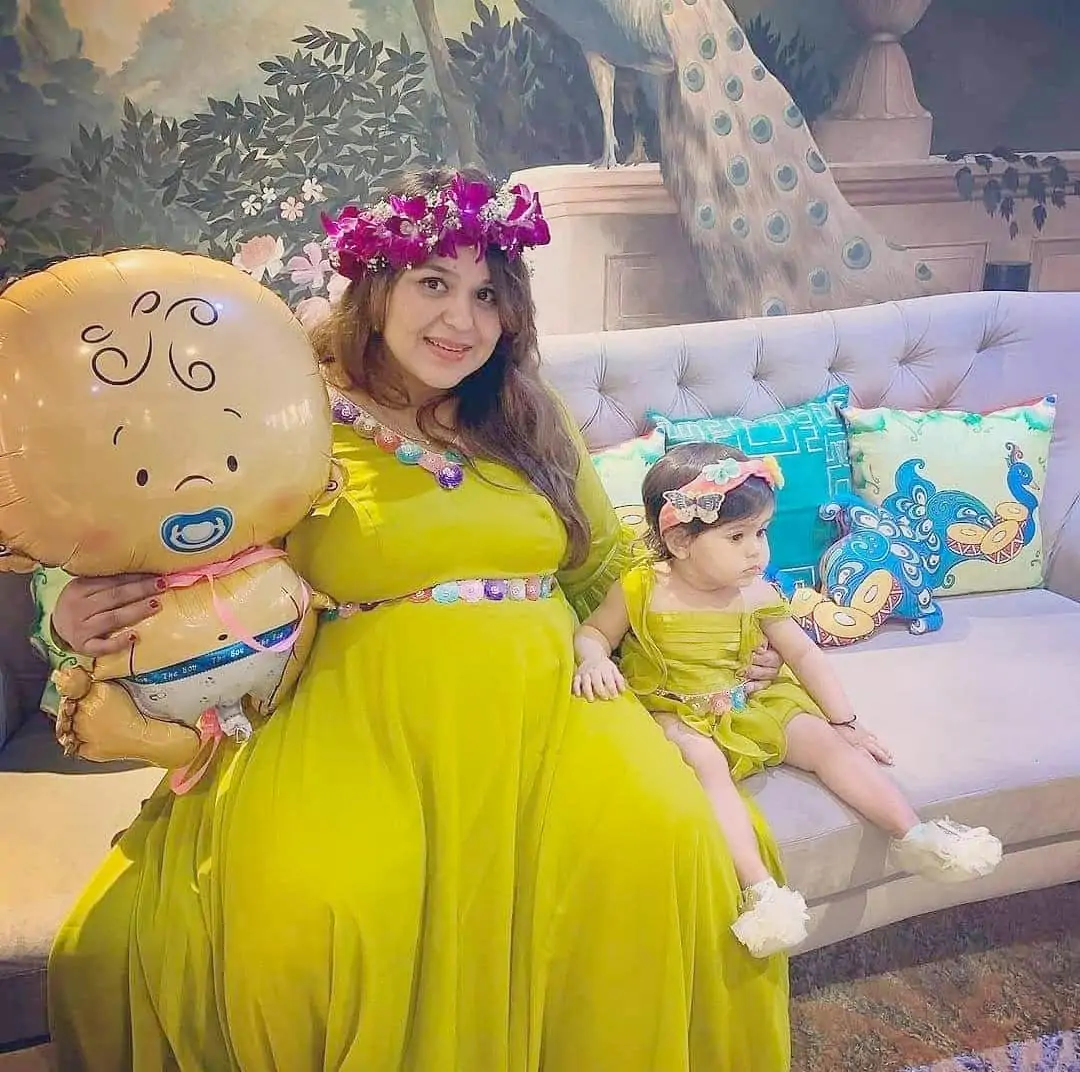 second baby shower photo with first baby