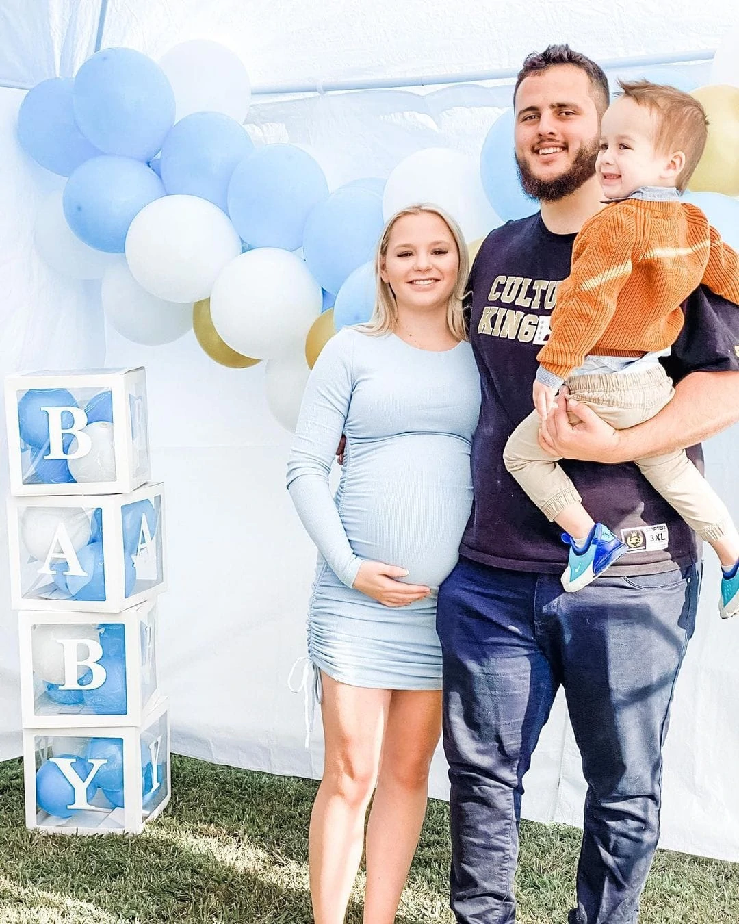 baby shower mom to be with husband and first child