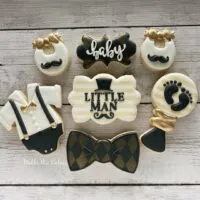 a picture of a little man baby shower cookies made by Maddie Mae Cookies in Florida