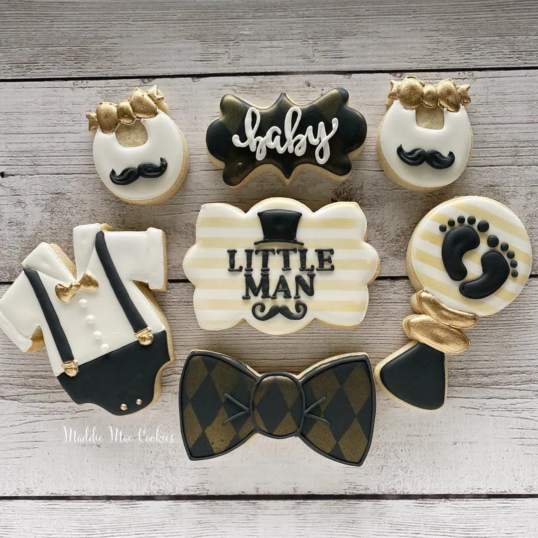 a picture of a little man baby shower cookies made by Maddie Mae Cookies in Florida