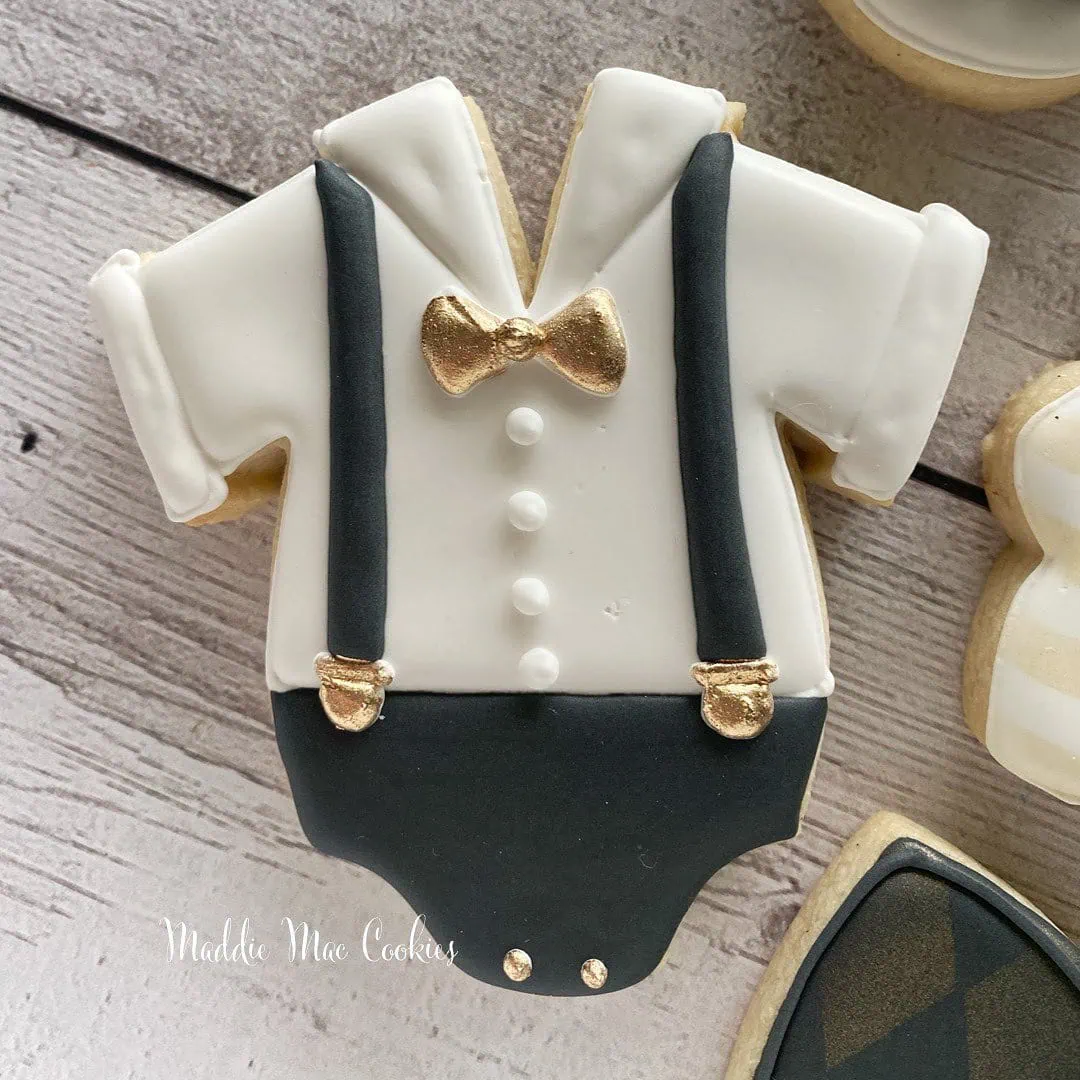 a picture of a little man baby shower cookies made by Maddie Mae Cookies in Florida