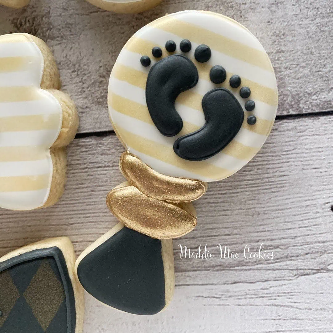 a picture of a little man baby shower cookies made by Maddie Mae Cookies in Florida