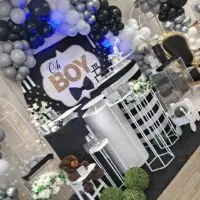 a picture of a little man baby shower organized by Red Balloon Events in Massachusetts