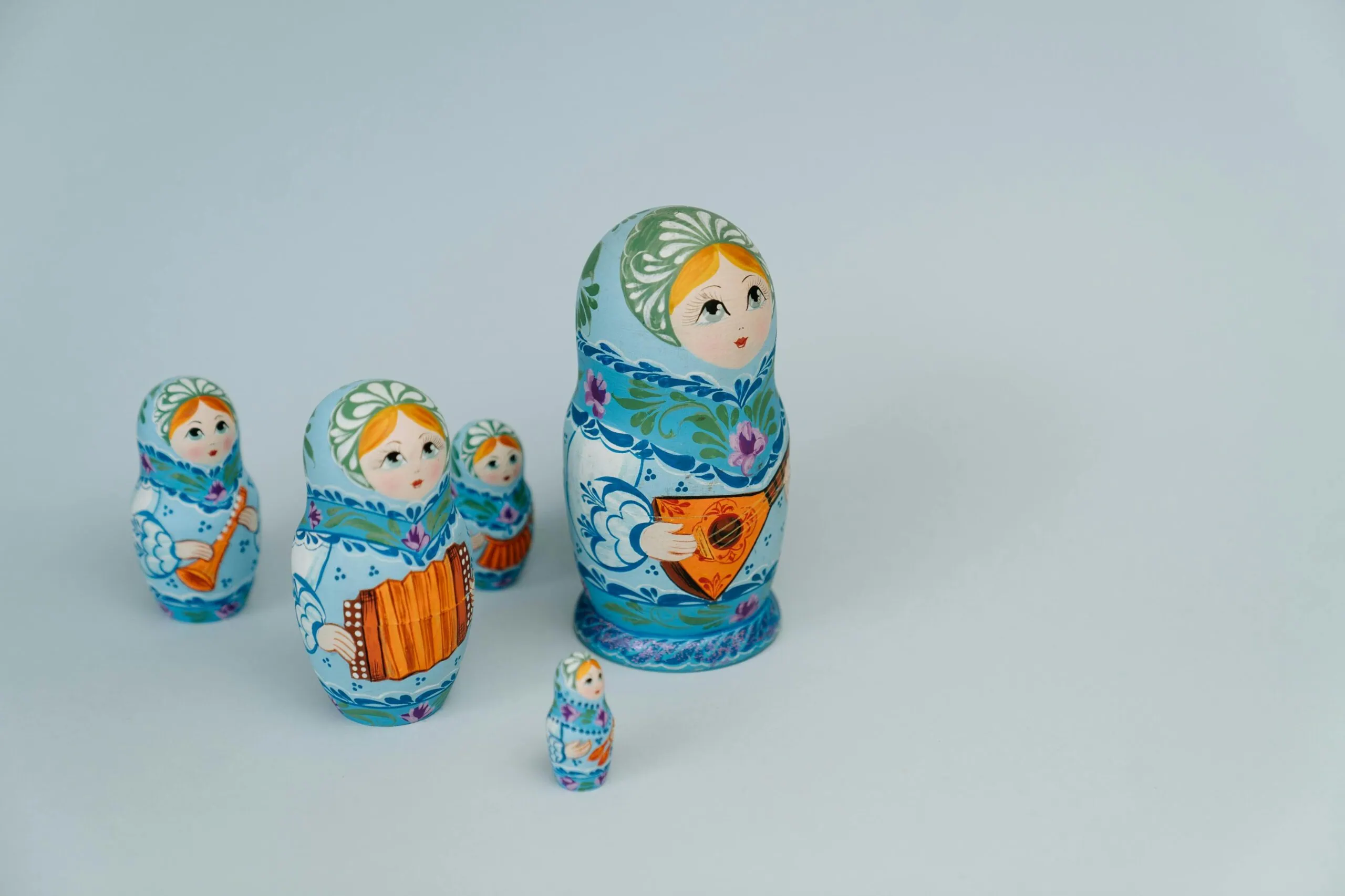 Vibrant Russian Matryoshka dolls in traditional attire, symbolizing family and culture.